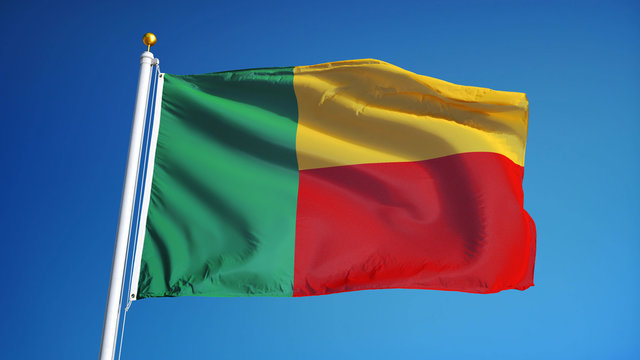Benin flag waving against clean blue sky, close up, isolated with clipping mask alpha channel transparency, perfect for film, news, digital composition