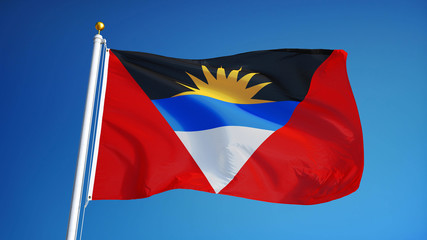 Antigua and Barbuda flag waving against clean blue sky, close up, isolated with clipping mask alpha channel transparency, perfect for film, news, digital composition