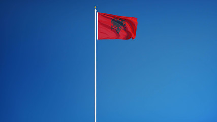 Albania flag waving against clean blue sky, long shot, isolated with clipping mask alpha channel transparency, perfect for film, news, digital composition