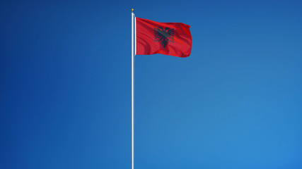 Albania flag waving against clean blue sky, long shot, isolated with clipping mask alpha channel transparency, perfect for film, news, digital composition