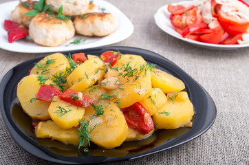 Stewed potatoes with bell pepper and onions, meatballs of minced