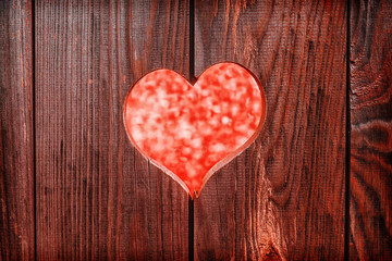 red heart on a background of wooden boards