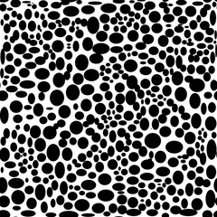 Seamless abstract black and white pattern of dots.