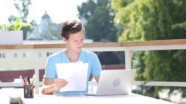 Sunny Day, Paperwork, Reading Details of Start Up Project