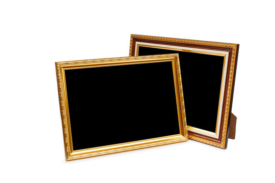 Gold vintage wooden photo frame isolated on white. Saved with cl