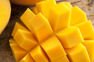 Delicious yellow mango peeled and cut into squares