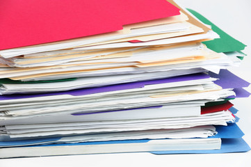 stacking documents and folders on white background