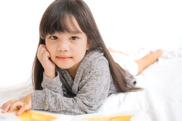 Fototapeta na wymiar portrait asia children, education and school concept -student girl reading book