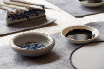 Obraz na płótnie Canvas chinese calligraphy tools on table