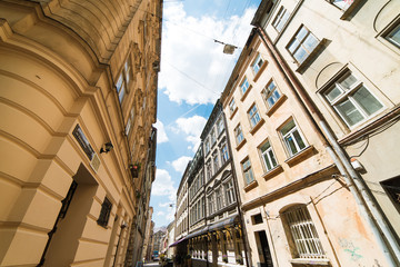 Obraz premium Old buildings facade on blue sky background in Lviv, Ukraine
