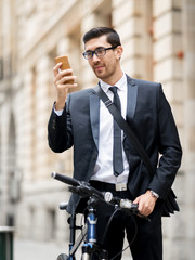 Young businessmen with a bike