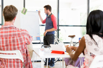 Casual businessman giving a presentation in the office