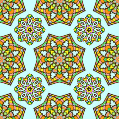 seamless pattern made from abstract mandalas on blue background