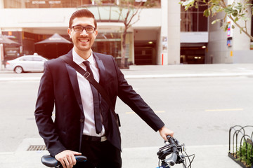 Young businessmen with a bike