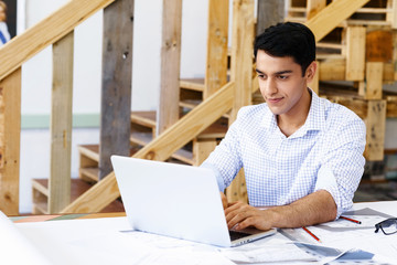 Young man architect in office