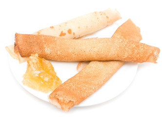 pancakes with honey on white background