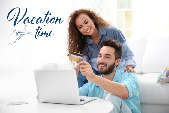 Vacation time concept. Young man and woman using credit card and laptop for online shopping