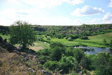 Green hills under blue sky