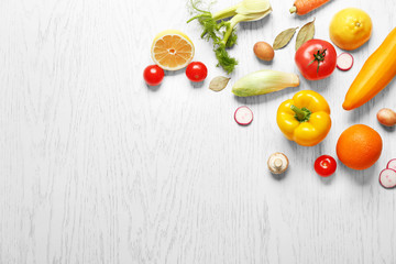 Naklejka na ściany i meble Fresh vegetables on wooden background