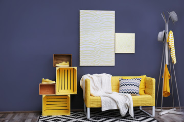 Stylish room interior with yellow couch
