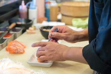 Obraz na płótnie Canvas making Japanese sushi 