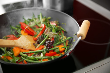 Mixing vegetables in pan closeup
