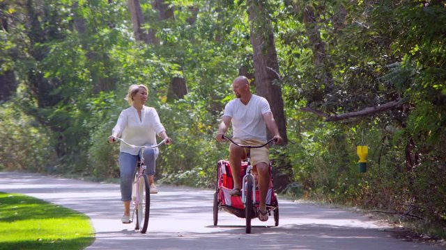 Couple riding bicycle in the park