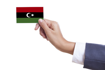 Businessman holding a business card with Libya Flag 