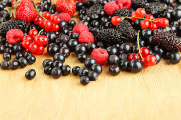 Berries on wooden background
