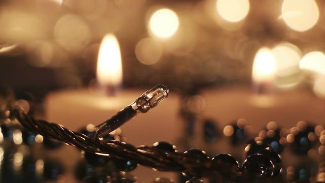 christmas lightbulb and candles close-up seamless loop
