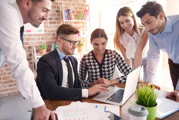 Workers gathered around the table