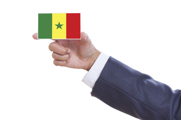 Businessman holding a business card with Senegal Flag 