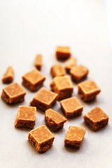 ..Toffees. Caramel pieces with copy space for your design over w