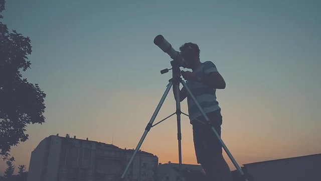 Stargazing through a telescope.