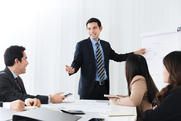 Businessman as a meeting leader giving presentation