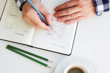 Close up of man sketching graphic sketch