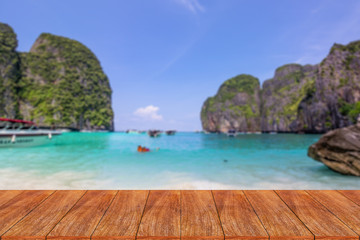 Wood table top on blurred beach background - can be used for dis