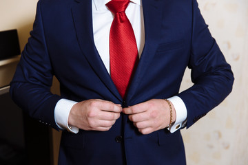 Businessman hands with cufflinks and clocks. Elegant gentleman clother