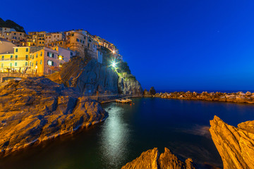 Manarola town on the coast of Ligurian Sea at night, Italy