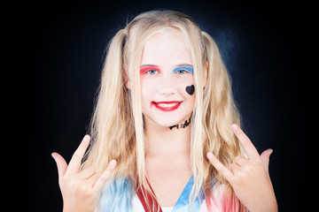 Cute Child Girl with Halloween Makeup having Fun