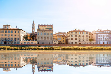 Cityscape view on the riverside with the old buildings and palaces near Holy Trinity bridge in Florence