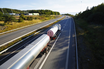 fuel and oil  truck in motion, elevated view from bridge