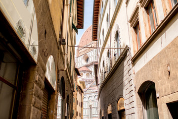 Florence street view with dome of Santa Maria del Fiore church in Italy