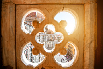 View through the gothic rose window on Duomo cathdral in Florence