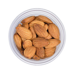 Top view of dried almond in plastic cup isoated on white .