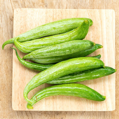 Snake gourd on wooden background