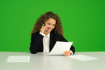 The young girl phone and work with document on the green background