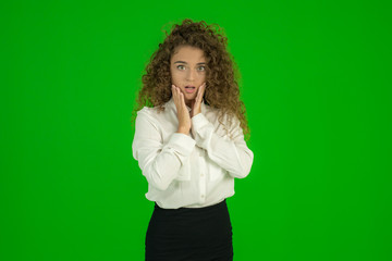 The businesswoman stand on the green background