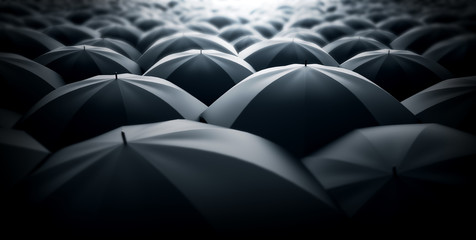 A sea of black umbrellas. Monotone society metaphor