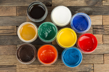Jars with a colorful paint gouache. Stock Image macro.